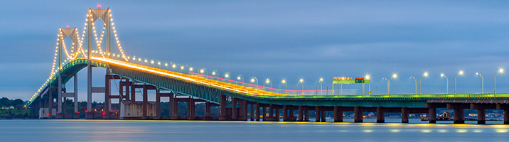 Rhode Island bridge at dusk with warm lights