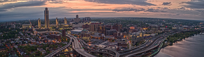 New York Skyline At Sunset with clouds and highway