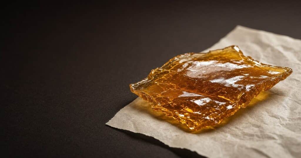 Translucent amber shatter sheet on parchment