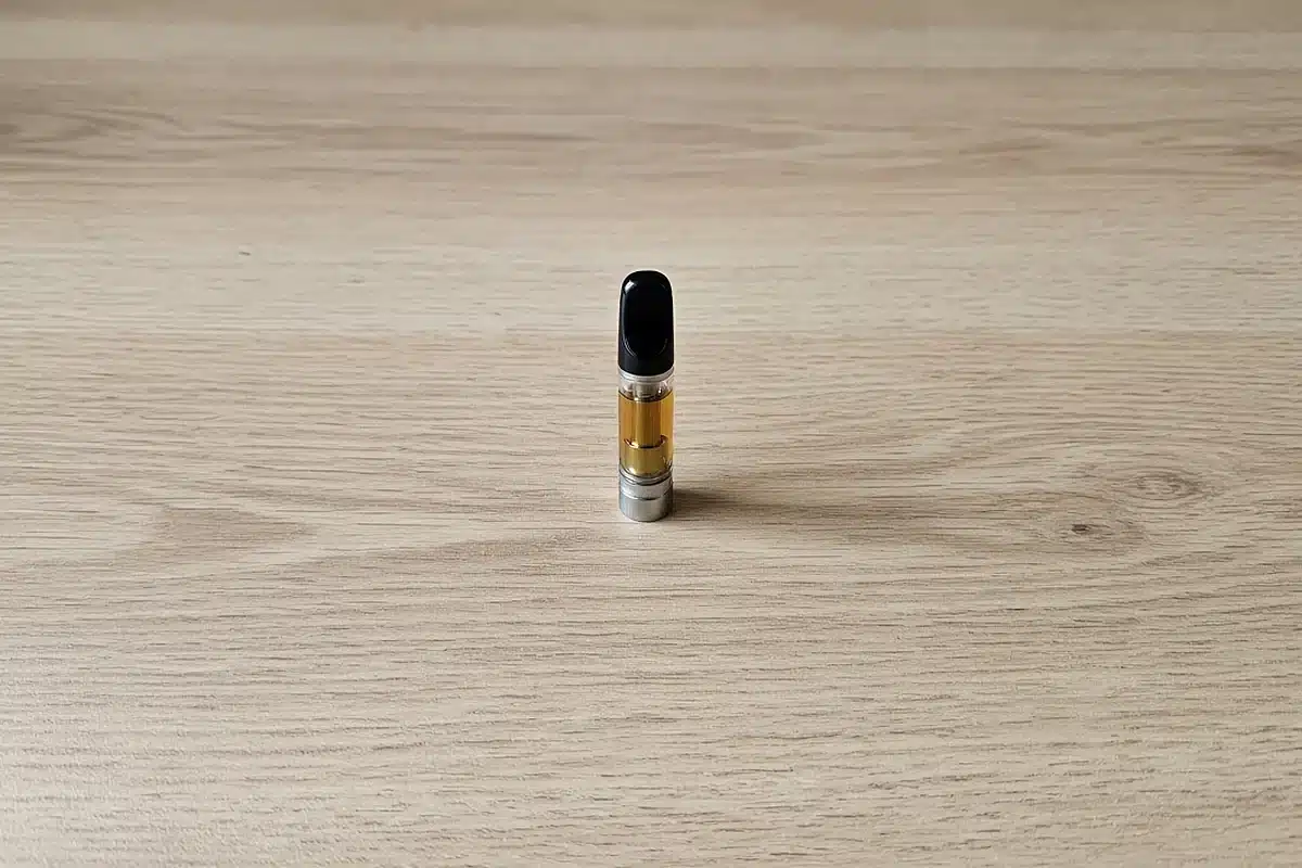 Unbranded cannabis oil vape cartridge on a table