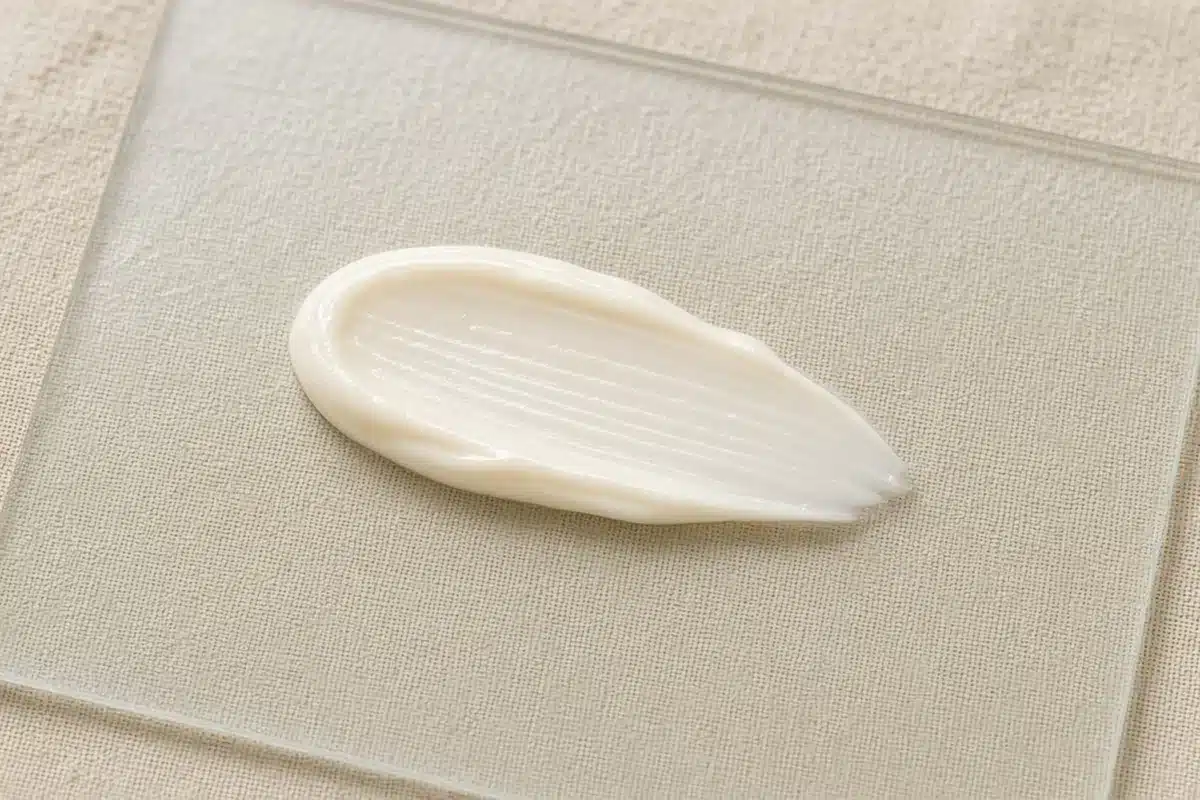 CBD cream swatch on glass