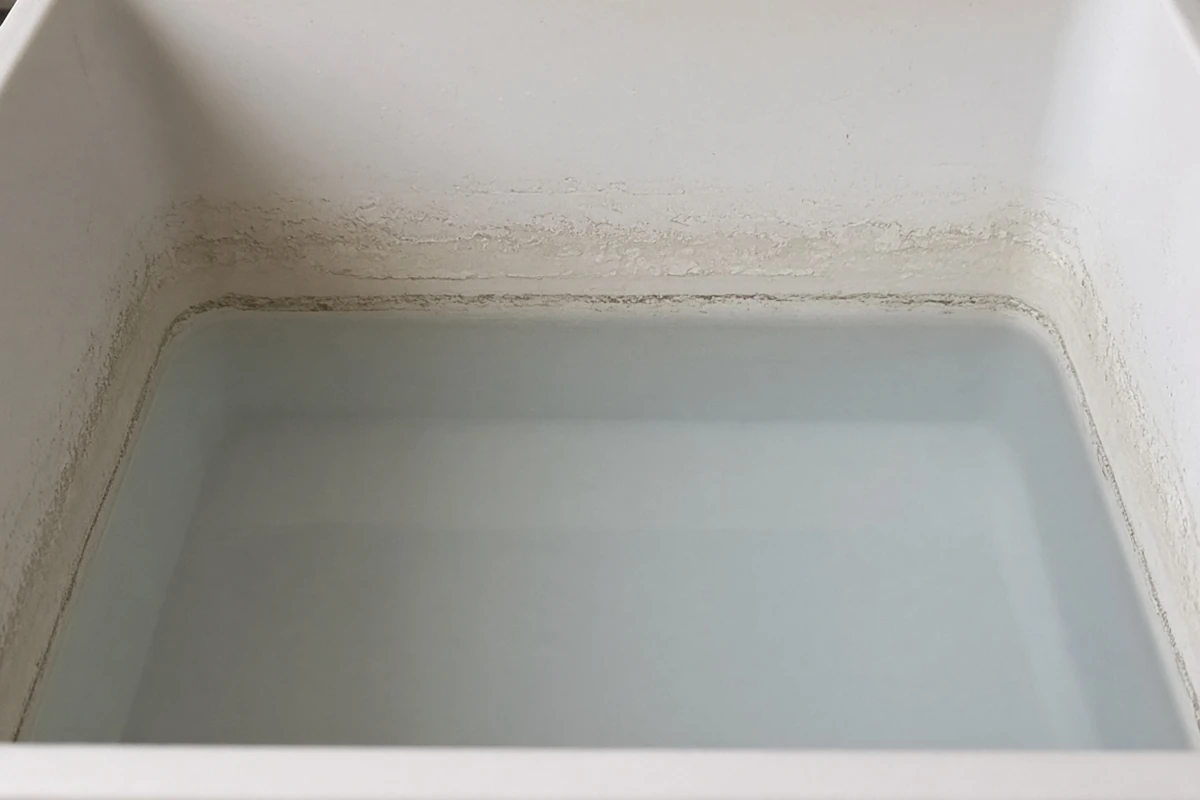 Close view of a water line mark inside a nutrient tote