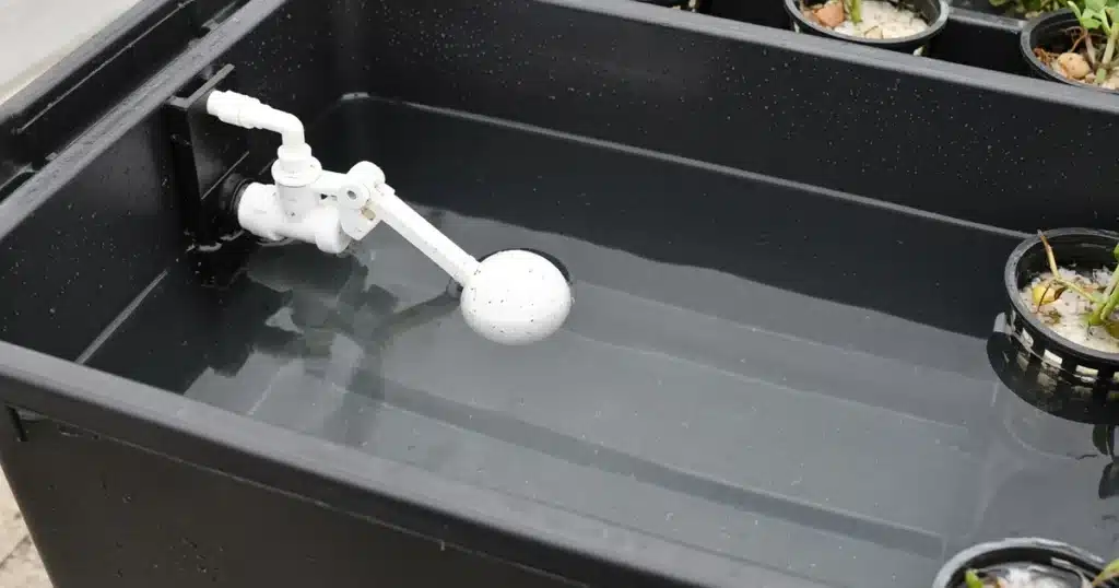 Float valve mounted inside a hydroponic reservoir